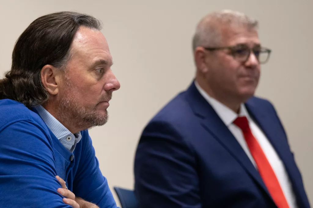 Darren Bailey (right) offers testimony during a hearing over allegations that he illegally coordinated campaign expenditures with GOP operative Dan Proft (left) during the 2022 gubernatorial campaign. (Capitol News Illinois photo by Andrew Adams)