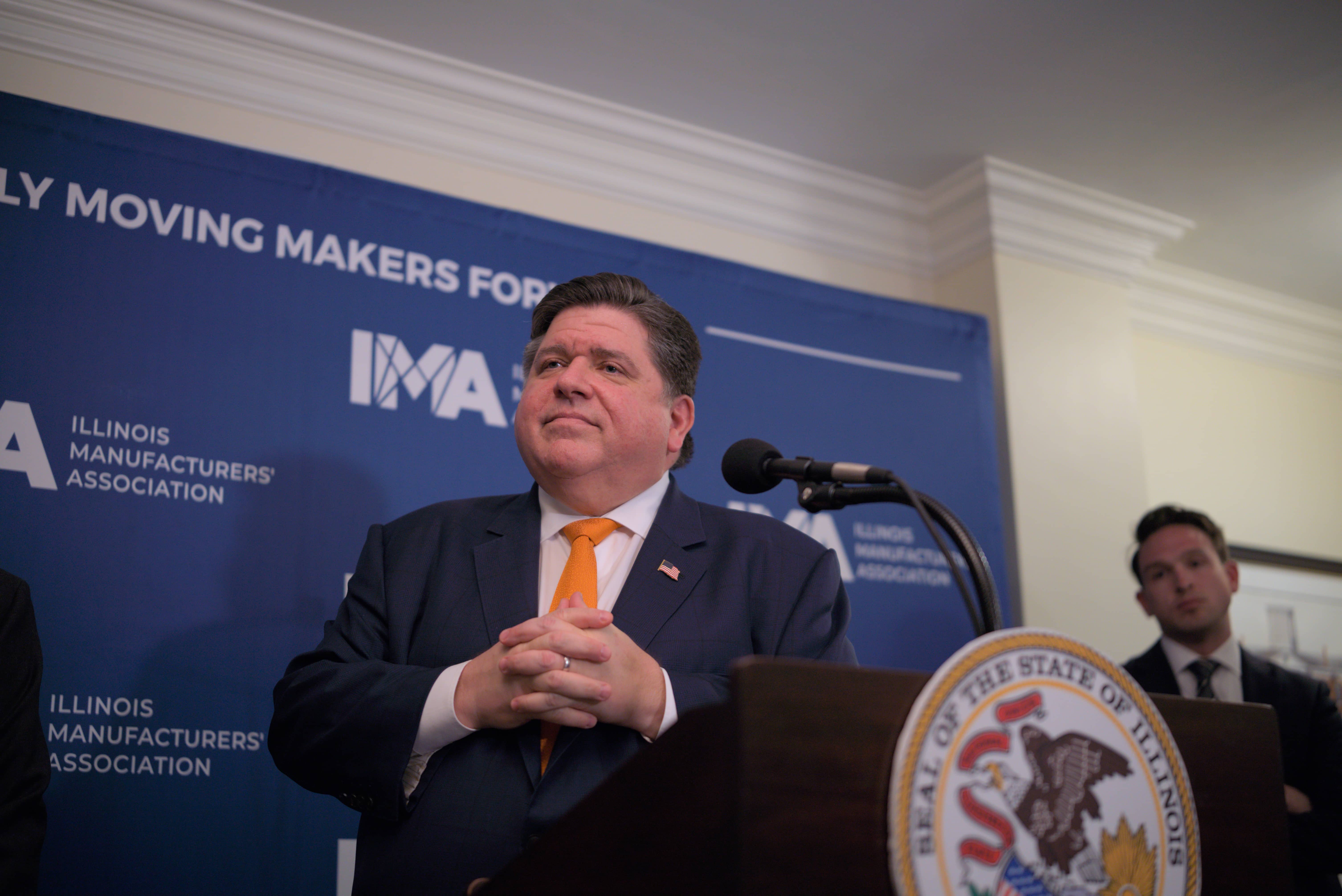 Pritzker listening to questions