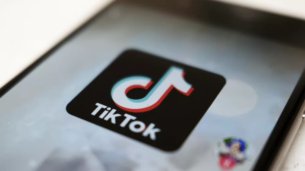 FILE - The TikTok logo is displayed on a smartphone screen in Tokyo on Sept. 28, 2020. TikTok says it's going to start automatically labeling content that's made by artificial intelligence when it's uploaded from certain platforms. TikTok says its efforts are an attempt to combat misinformation from being spread on its social media platform. The announcement came on ABC's “Good Morning America” on Thursday, May 9, 2024. (AP Photo/Kiichiro Sato, File)
