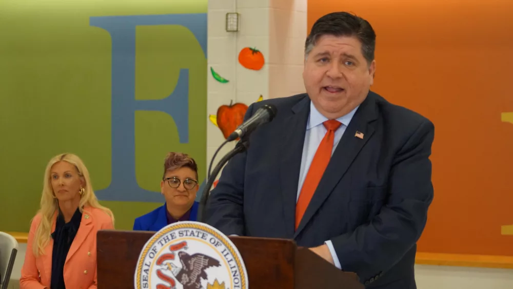 Gov. JB Pritzker announces the launch of a new summer nutrition program for school-age children during a news conference at Enos Elementary in Springfield. (Capitol News Illinois photo by Peter Hancock)