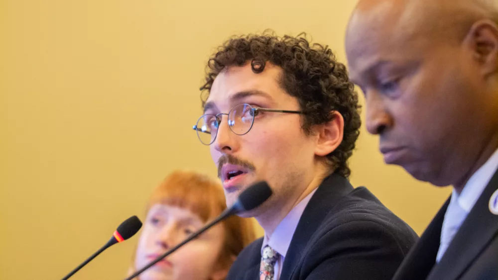 Brady Burden, a member of the Illinois Legislative Staff Association organizing committee, is pictured with House Speaker Emanuel “Chris” Welch in an October 2023 committee hearing. (Capitol News Illinois photo by Jerry Nowicki)