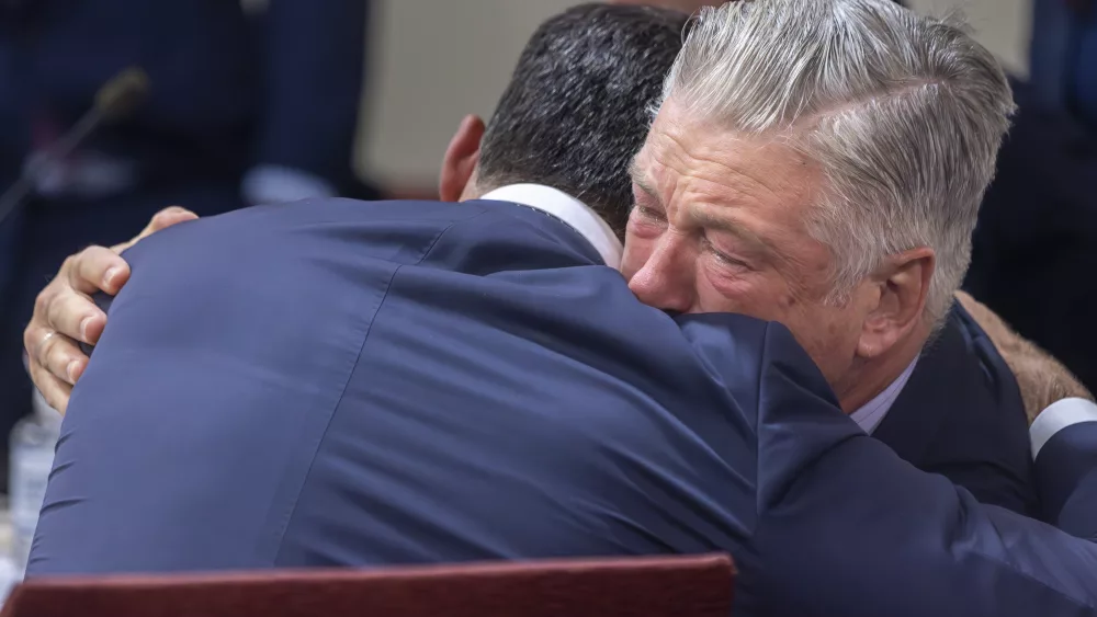 Actor Alec Baldwin, right, hugs his defense attorney Alex Spiro after District Court Judge Mary Marlowe Sommer threw out the involuntary manslaughter case for the 2021 fatal shooting of cinematographer Halyna Hutchins during filming of the Western movie "Rust," Friday, July 12, 2024, in Santa Fe, N.M. (Luis Sánchez Saturno/Santa Fe New Mexican via AP, Pool)