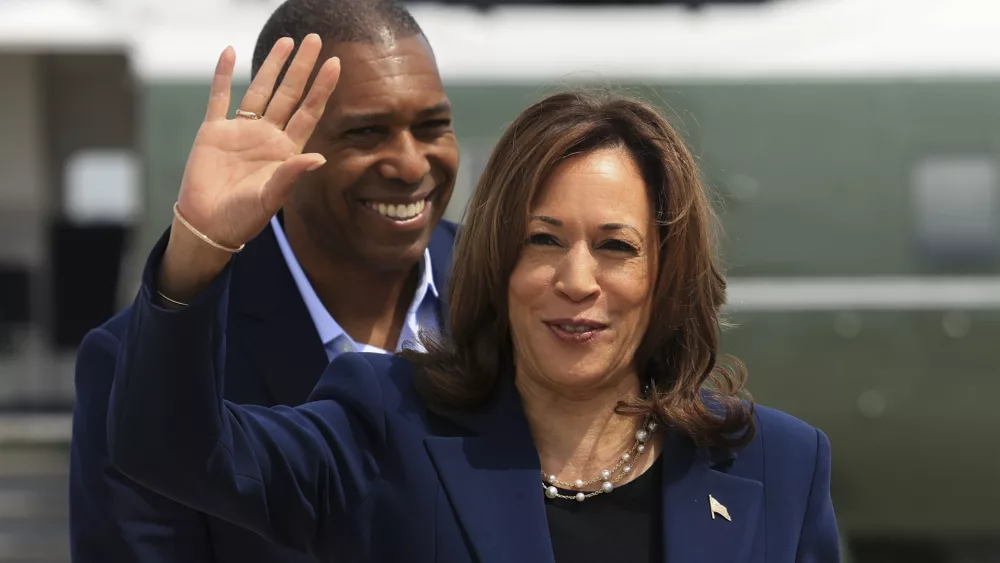 Vice President Kamala Harris waves before boarding Air Force Two as she departs on campaign travel to Milwaukee, Wisc., Tuesday, July 23, 2024 at Andrews Air Force Base, Md. (Kevin Mohatt/Pool via AP)
