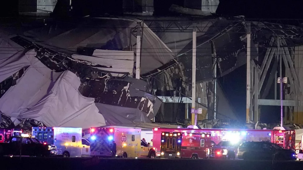 FILE - An Amazon distribution center is heavily damaged after a strong thunderstorm moved through the area, Dec. 10, 2021, in Edwardsville, Ill. On Tuesday, April 26, 2022, the federal Occupational Safety and Health Administration said its investigation into the deadly collapse of the warehouse has “raised concerns about the potential risk to employees” during weather emergencies. (AP Photo/Jeff Roberson, File)