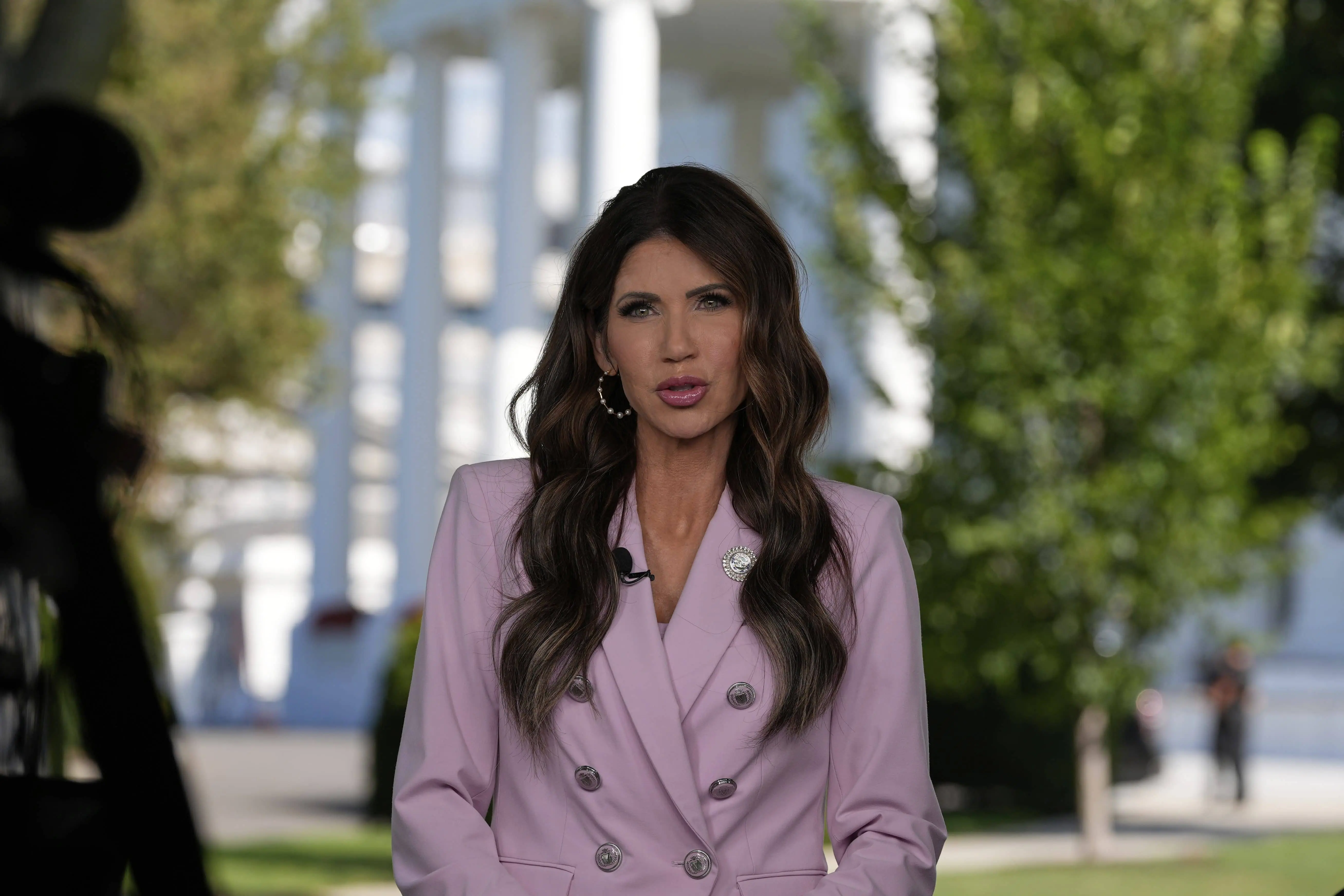 Homeland Security Secretary Kristi Noem speaks during a television interview at the White House, Tuesday, Aug. 26, 2025, in Washington. (AP Photo/Alex Brandon)