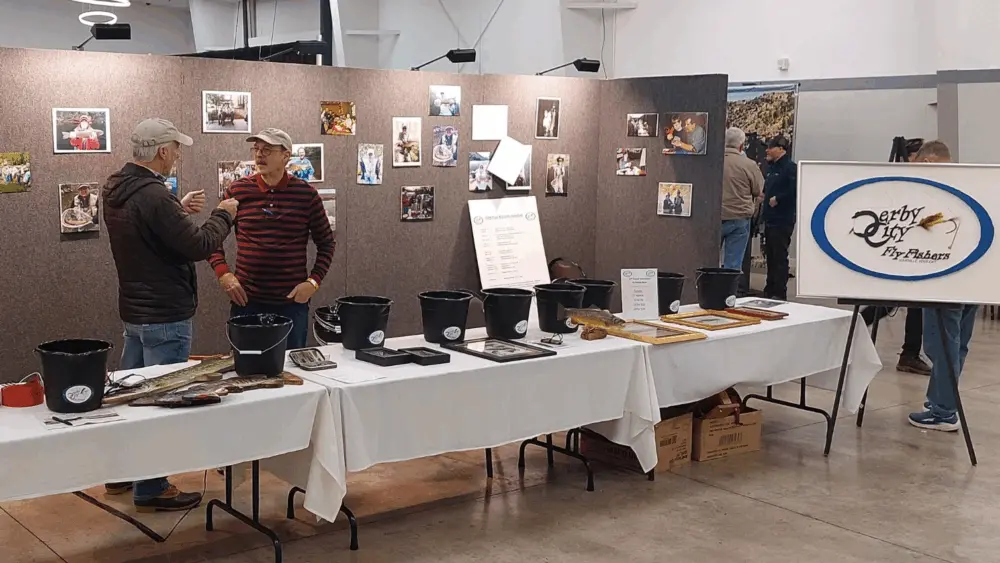 Two men conversing at a previous Kentuckiana Fly Fishing show