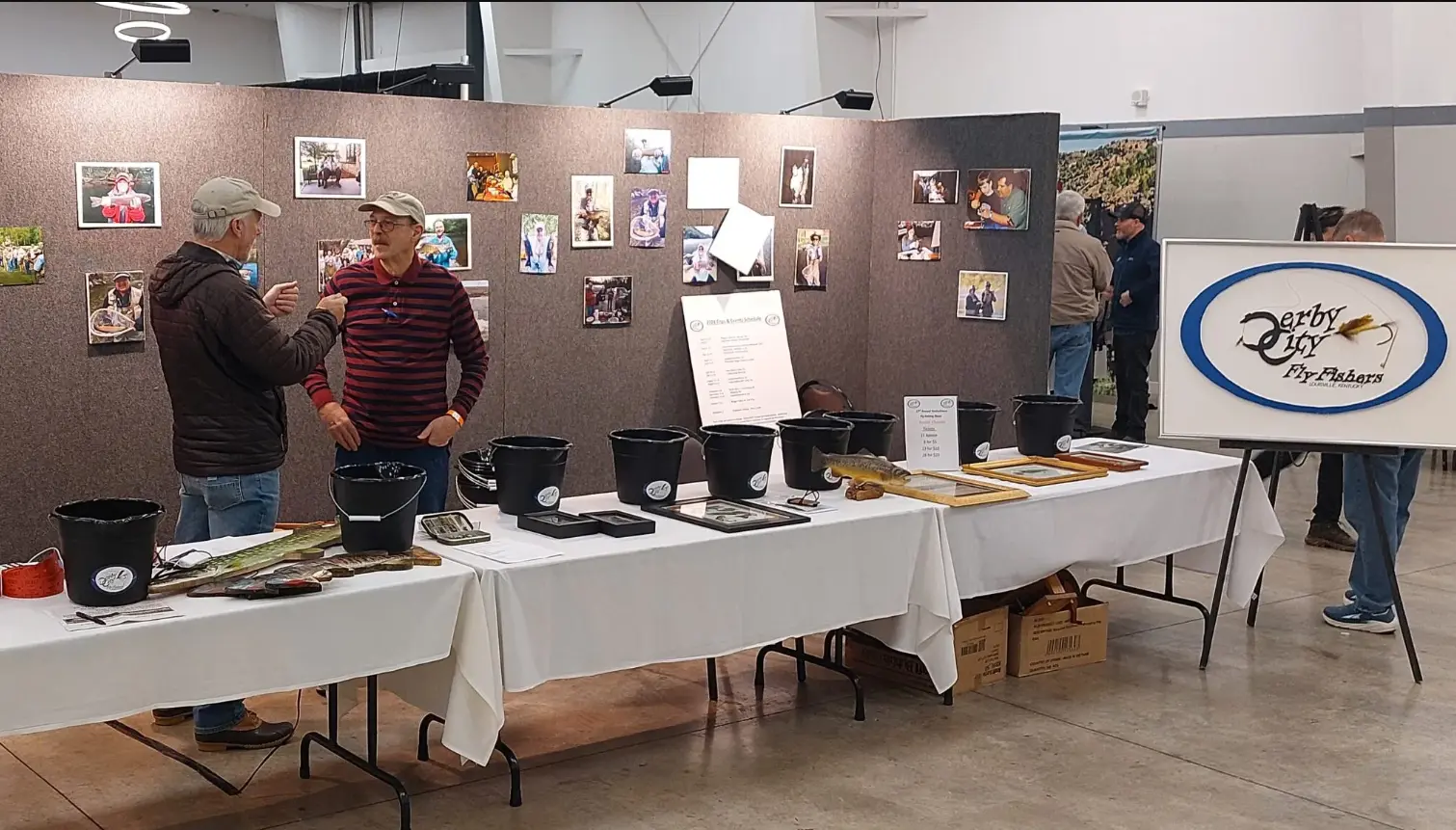 Two men conversing at a previous Kentuckiana Fly Fishing show