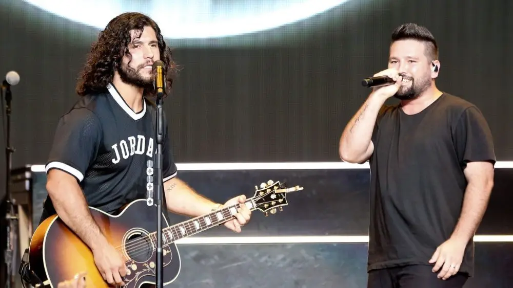 Dan Smyers (L) and Shay Mooney of Dan + Shay perfor during the "Can't Say I Ain't Country" Tour on July 20^ 2019 at Northwell Health at Jones Beach Theater in Wantagh^ New York.