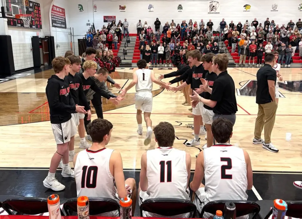 Woodland senior Nolan Price celebrated turning 18 years old Monday by draining 3s on four consecutive possessions right before halftime, advancing past Earlville 70-25 in the opening round of the Class 1A Woodland Regional alongside his Warriors teammates and breaking his school’s single-season scoring record.Happy birthday, kid.“I think it’s just been a really good year all around,” said Price, who with the late first-half barrage of 3-pointers surpassed Matt Niehaus’ 34-year-old single-season school record of 533 points. “I didn’t think that I’d get that [record] at all, didn’t have that high of expectations at the beginning of the season.“But as the season’s grown on, I’ve kind of had the feeling the team and I could do a lot. And we did.”Price and the rest of the regional top-seeded Warriors (23-9) will face Henry-Senachwine at 6 p.m. Wednesday, the Mallards an 82-59 victor Monday over Leland. Woodland, the No. 2 seed in its half of the 1A Amboy Sectional, defeated Henry-Senachwine, the No. 7 seed, twice during the regular season – 61-45 and 55-44.It would be difficult to imagine things going any better for the Warriors on Wednesday than they did Monday. After Earlville (1-29) took a brief 3-2 lead on a Colton Fruit trey in the opening minute, Woodland rattled off a 20-0 run that made the time remaining on the scoreboard more interesting than the score for the rest of the evening.Woodland’s lead reached 10 points (13-13) on a Nate Berry jumper just over five minutes into the contest; 20 (28-8) on a Jaron Follmer old-fashioned three-point play 4:27 before halftime; 30 (38-8) on the first of Price’s aforementioned four consecutive 3s over a 1-minute, 44-second stretch just before halftime; 40 (49-8) when a Follmer turnaround jumper bounced in 38 seconds into the second half; and 50 points (70-18) on a Noah Lopez 3-point bucket with Woodland’s starters all on the bench and 3:03 remaining.“That’s always the goal this time of year, to stay healthy and go right [on the bracket],” Warriors coach Connor Kaminke said. “It’s been an awesome season and we’ve gotten a taste for winning, but I also want to remind these kids that you can never miss an opportunity to appreciate the heck out of every win.“Most of my career on the sidelines and most of this school’s history, there hasn’t been a whole lot of winning going down, year by year – especially when you get down to the postseason. In my nine years [coaching], this is only the third time we’ve advanced in regional play.“There’s plenty to be proud of this year, but we still shouldn’t miss an opportunity to be excited and proud to be advancing in the postseason.”Woodland outshot the Red Raiders 47.3% (26 of 55) to 25.0% (9 of 36), also winning the turnovers forced battle 27-6. Earlville outrebounded its hosts 31-23, and was led on the night by Colton Fruit’s six points, four points from both Darik Farley and Rob Tinson, and a four-point, eight-rebound, two-steal performance put in by Logan May.“We’re a young team that’s kind of in transition right now,” Earlville coach Gerald Fruit said, “but they came to play. It was a rough season, but we’re growing. We’re developing.“Woodland sets a lot of picks, and they’re bound and determined to get No. 2 (Price) and No. 11 (Berry) a lot of looks. We tried to defend those picks, but they’re good athletes, and they still got their points.”While Price’s historic birthday performance included 17 points, a game-high five assists and four steals, sophomore Nate Berry actually led the team in scoring with 26 points and added four rebounds. Follmer (11 points, six steals), Noah Decker (three points, five assists), Brezdyn Simons (two points, five rebounds, five steals) and off the bench Grant Wissen (six points) also contributed for the regional hosts.