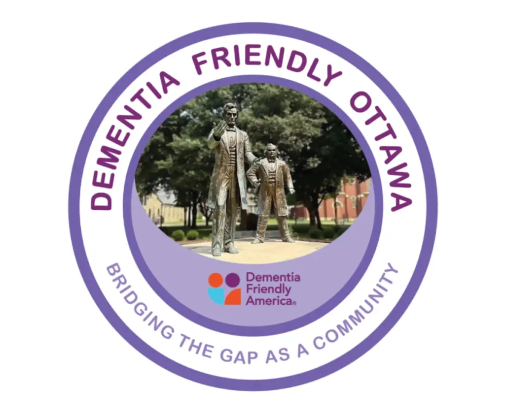 The city of Ottawa is now officially a “dementia-friendly city”. After a year of work by community leaders to collaborate, educate, and train, Dementia Friendly America has recognized Ottawa for its commitment to making the city safe and friendly for people with dementia.According to the Dementia Friendly America website, “A dementia-friendly community is a village, town, city or county that is informed, safe and respectful of individuals living with dementia, their families and caregivers, and provides supportive options that foster quality of life.”Dementia Friendly America formally recognized Ottawa as dementia-friendly on Feb. 3, approving its application after a year of work spearheaded by Pleasant View Senior Living Senior Resident Life Director and Memory Support Director Joelle Patterson, and Pavilion Healthcare of Ottawa Activity Director Christine Simmons.“The two of us got together and wanted to make it happen for the town of Ottawa,” Patterson said. “Luckily, we have an amazing community and it did not take much effort to get some key people from the community and business owners together in a room, so we were very, very fortunate for that.”The Ottawa Police and Fire departments, La Salle County Health Department, City of Ottawa, T4 Medical, Spry Geriatric Therapy Group, Reddick Library, Nells Woodland, Alzheimers Association, La Salle County Nursing Home, YMCA, American Legion, NCAT and OSF were among those who participated.Patterson said they met at the Reddick Library every month for a year to discuss what becoming “dementia-friendly” would entail for the city of Ottawa.“We’ve been going through trainings to become dementia champions, to present dementia talks, to be able to make people and businesses a dementia friend or dementia friendly business,” Patterson said. “We really hope to make as many businesses dementia friendly in the town.”The dementia-friendly initiative follows similar efforts from Mendota, Princeton and other local municipalities.“We’re looking at education for community members, support for the caregivers and providing safe spaces for the people living with dementia,” Patterson said.A large part of this effort comes from the training of the action team, which will complete its final training later this month to become official dementia friends in the eyes of Dementia Friendly America.“The training goes over basic knowledge of dementia, the difference between Alzheimer’s and dementia, and offers some tools that they can use to communicate and give simple steps to a person with dementia that will make it easier for them to establish what they’re trying to do,” Patterson said.Dementia Friendly America defines dementia as an umbrella term referring to a range of neurological conditions that affect a person’s brain over time, affecting a person’s cognitive abilities, such as their ability to think, remember, and reason, to levels that interfere with daily life.Patterson said she hopes the work of the community and the recognition from Dementia Friendly America will impact more than just residents living with dementia. “I think it’s going to help everyone involved. It’s going to help the person living with dementia feel included in the world they live in. We’re here to support the caregivers who are their main support as well,” Patterson said. “I want to live in a community where, if someday I develop dementia, I’m supported, loved and cared for by the community that I’ve lived in my entire life.”Dementia Friendly America is a national network of communities, organizations and individuals seeking to ensure that communities across the U.S. are equipped to support people living with dementia and their care partners.For more information, call 202-872-0888 or email dfstarvedrock@gmail.com.