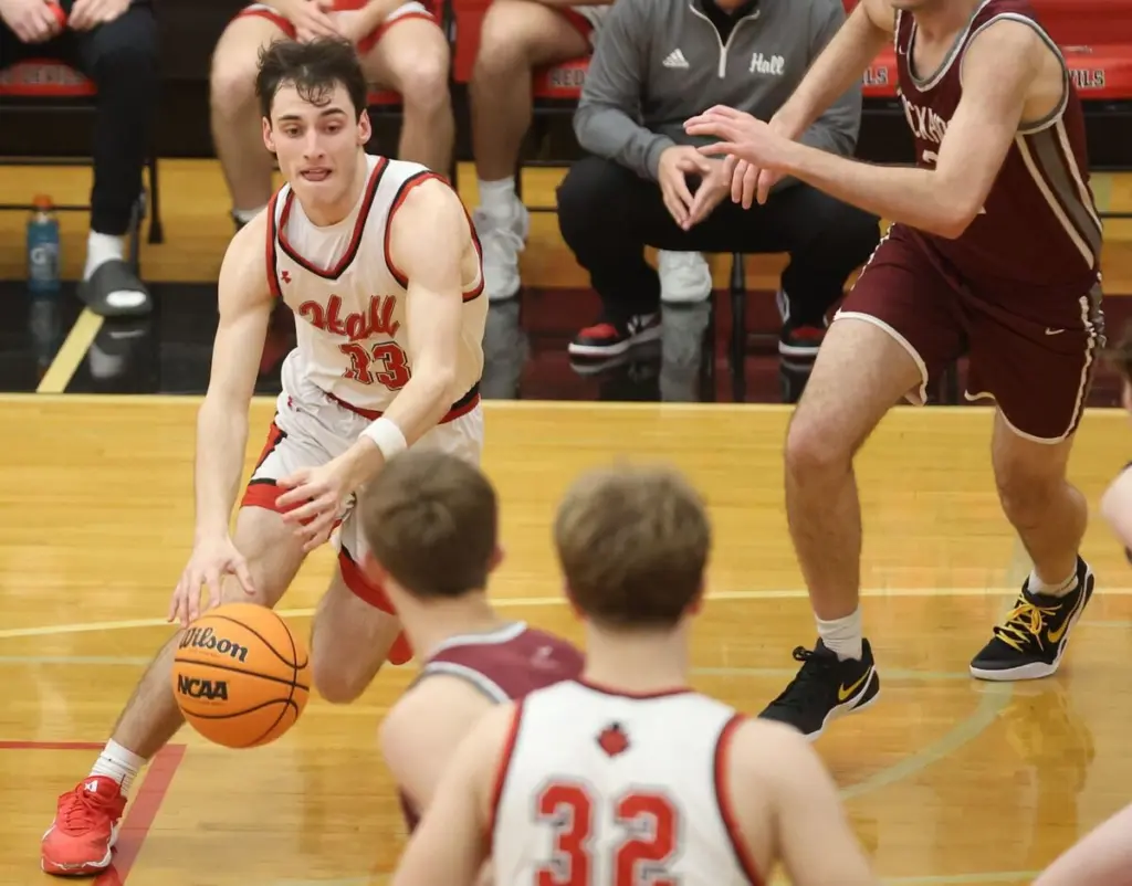 Braden Curran, Hall, sr.The high energy senior forward led the Red Devils across the board in scoring (14.8), rebounds (6.4) and steals (2.6) while playing lockdown defense. He became the 13th 1,000-point scorer in program history. He was an unanimous Three Rivers East All-Conference selection and received IBCA Class 2A Special Mention honors.Gino Ferrari, St. Bede, sr.The southpaw shooter was the Bruins and area’s leader in scoring (15.3) and rebounding (7.7) while shooting 27% on 3s. He led the Bruins to a Class 1A regional championship appearance, earning second-team Tri-County All-Conference honors.Carson Gruber, Bureau Valley, fr.The rookie hot shot splashed onto the scene with a freshman tournament record 37-point effort against Princeton at the Colmone Classic, including nine 3-pointers. He led the Storm in scoring at 14.7 ppg while averaging 2.0 assists and 1.3 steals, shooting 35% on 3s. He was named first-team Lincoln Trail All-Conference.Gavin Lanham, Princeton, sr.The senior guard gave the Tigers a floor leader as the only returning starter from their 2024-25 sectional finalist. He averaged 9.9 points, 2.1 assists and 2.2 steals while shooting 33% on 3-point shooting. He was named second-team Three Rivers East All-Conference.Chace Sterling, Hall, so.The young Red Devil had a Sterling sophomore season, providing Hall a much-needed inside presence, whose absence was felt when he went out with an injury. The Hall big man averaged 10.4 points and 6.4 rebounds, second on his team only to Braden Curran. He earned Three Rivers East All-Conference Honorable Mention. Blake Foster, Bureau Valley, jr.Foster had a well-rounded game for the Storm, averaging 9.6 points, 5.4 rebounds and 1.7 steals. He will be remembered most for the shot of the year with his full-court sling to spark the Storm to a 55-53 win at Hall. Foster was named second-team Lincoln Trail All-Conference.Jack Oester, Princeton, so.Oester stepped up in his first season on the Tigers’ varsity, using his ability to drive to the hoop for a team-high scoring average of 10.2 ppg along with 3.1 assists per game. He received Honorable Mention honors in the Three Rivers East.Logan Philhower, Bureau Valley, sr.Philhower had a solid senior season for BV averaging 9.5 points, 2.8 rebounds and 1.4 steals per game. He led the Storm with 37% shooting on 3-pointers. He was named Special Mention Lincoln Trail All-Conference.Noah Plym, Hall, jr.The junior guard provided the Red Devils with a third double-figure scorer, averaging 10.0 ppg along with 2.0 assists. Plym received Honorable Mention honors in the Three Rivers East.Alex Tomsha, St. Bede, jr.The junior guard gave the Bruins an outside scoring threat the moment he walked onto the floor, making good on an area-best 85 3-pointers (37%). He averaged 9.2 ppg. He earned Honorable Mention honors in the Tri-County All-Conference.Greyson Bickett, Hall, sr.Bickett gave the Red Devils a steady influence at point guard, dishing out 2.2 assists per game. He also averaged 7.2 points while shooting 27% on 3s and 73% on free throws along with 1.2 steals a game.Gus Burr, St. Bede, sr.Burr gave the Bruins a well-rounded, hard-nosed game. The senior guard was the area leader in assists at 3.3 per game while averaging 7.1 points, 3.7 rebounds and 1.2 steals.Carter Chhim, Bureau Valley, jr.Chhim played an all-around game for the Storm, averaging 7.4 points, 2.9 assists and 1.2 steals along with 2.7 rebounds per game. The junior guard was named Special Mention Lincoln Trail All-Conference.Jackson Mason, Princeton, sr.Mason made the most of his opportunity stepping into the Tigers’ starting lineup this season, averaging 9.5 points and 2.0 assists with 34 3s. The senior forward will forever be remembered for his game-winning shot at the buzzer against Hall. Carson Riva, St. Bede, sr.Riva led the area in 3-point shooting with a 38% clip. He also averaged 6.6 points, 3.2 rebounds, 3.1 assists and 1.5 steals.Harley Blair, LaMoille, jr.; Stihl Brokaw, Princeton, sr.; Connor Deering, LaMoille, sr.; Ryan Jagers, Princeton, sr.; Julian Mucha, Princeton, fr.; Diego Perez, so., DePue; Graham Ross, St. Bede, so.