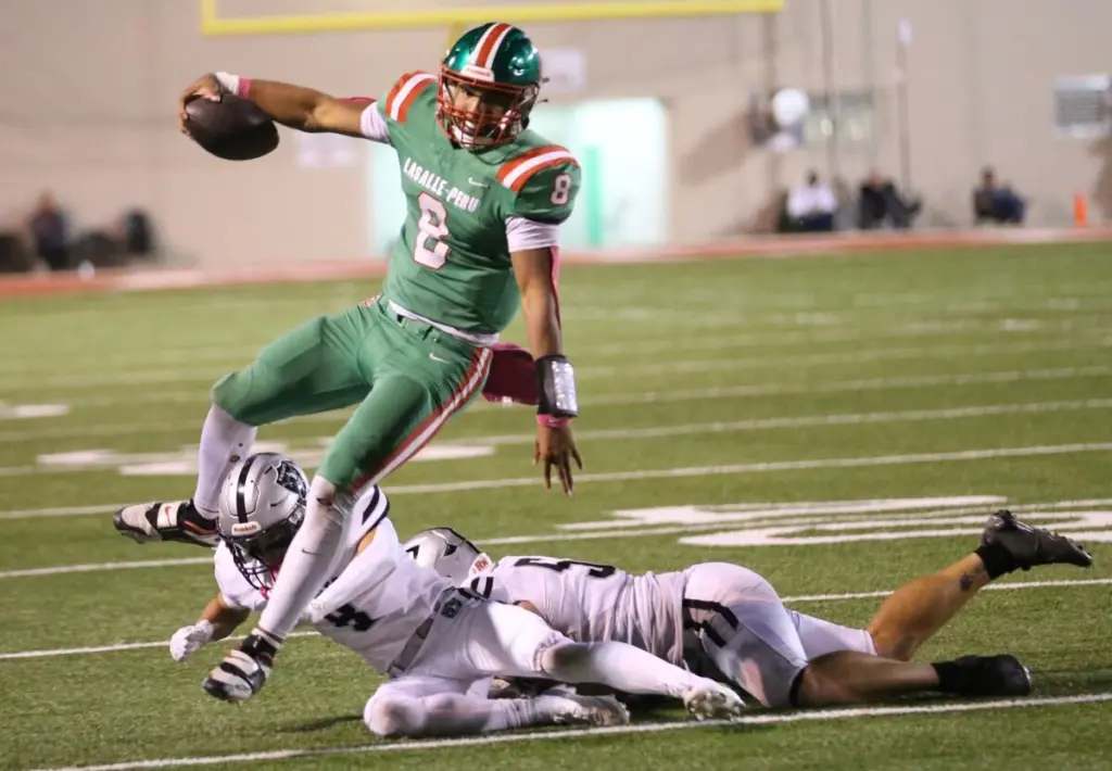 Two-time All-Interstate 8 Conference quarterback Marion Persich, a highly-touted recruit in the Class of 2028, will still be giving conference teams fits this fall, but he’ll do so wearing a different uniform.Persich is transferring from La Salle-Peru to Morris for the 2026 season.The 6-foot-4, 220-pounder has been on game day visits to Illinois, Northwestern and Michigan State. He’s going to camps this summer at North Dakota State and San Diego State. He also has camp invites from several other schools, including Missouri, Missouri State, Michigan State, Wisconsin and Iowa.“I think it’s a good opportunity,” said Persich, whose transfer comes as his father’s fencing company expands into Morris.In two varsity seasons at La Salle-Peru, Persich completed 199-of-385 passes for 2,607 yards and 17 touchdowns while running for more than 1,100 yards and 19 TDs.Persich also is a two-time Friday Night Drive Team of the Week MVP, winning the award in each his freshman and sophomore seasons.The Cavaliers went 5-13 overall and 2-8 in the conference with four wins overall and both conference wins coming against Ottawa.“I really loved it at L-P,” Persich said. “It’s a great community. I love all the people. I love my team and I’m glad for all the stuff I learned over my two years at L-P with (assistant) coach (Jared) Mundt and coach JJ (Raffelson). It was a good experience.”Persich joins a Morris program that has made six consecutive playoff appearances, reaching the Class 4A semifinals last fall and the Class 5A semifinals in 2024. Morris has double-digit wins in four of the last five seasons.“I definitely think it will be a little easier, especially with them being a good program,” Persich said. “They already have good talent. I think me coming there, being able to really control the offense and being able to make them more of a passing and running team should definitely be a good advantage for them. Having the O-line they have should also be better for me having more time in the pocket and really being able to become a passing quarterback instead of just running.”Persich said he hopes to lead Morris to another deep playoff run.“When I first get there I need to most definitely build bonds with them and get everyone on the same page with me and just get everyone’s confidence up the first couple games.,” Persich said. “We should be able to go on a good run this year.”Persich will return to L-P’s Howard Fellows Stadium for the Interstate 8 Conference finale on Oct. 9. Persich also will play basketball for Morris after helping the Cavaliers to their third consecutive regional title last winter and earning NewsTribune Boys Basketball Player of the Year.“It’s definitely going to be an experience,” Persich said about returning to L-P to play football and basketball. “I know a lot of people are pretty upset about me moving, but I definitely think it will be a good experience. It should be a good game.”