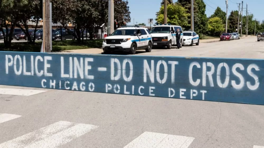 POLICE LINE DO NOT CROSS sign courtesy of the Chicago Police Department. Chicago - Circa May 2021