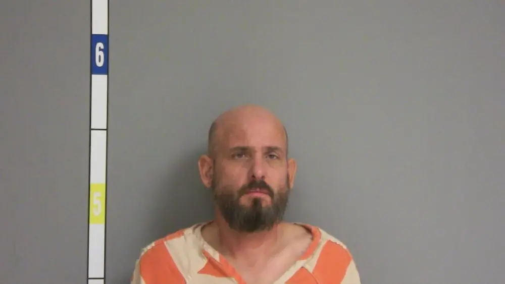 Prosecutors say the family dog saved the woman when a pet dog intervened.