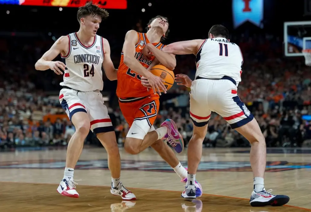 UConn got another critical 3-pointer from Braylon Mullins and coach Dan Hurley’s Huskies muscled their way back to the national title game, beating Illinois 71-62 in the Final Four on Saturday night as they seek their third championship in four seasons.