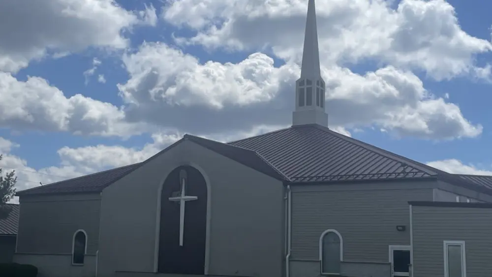 A keen-eyed motorist may have saved a Peru church from fire early Easter Sunday.