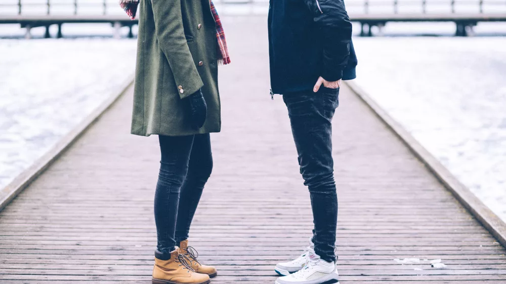 two-people-standing-on-the-pier