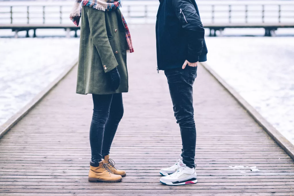 two-people-standing-on-the-pier