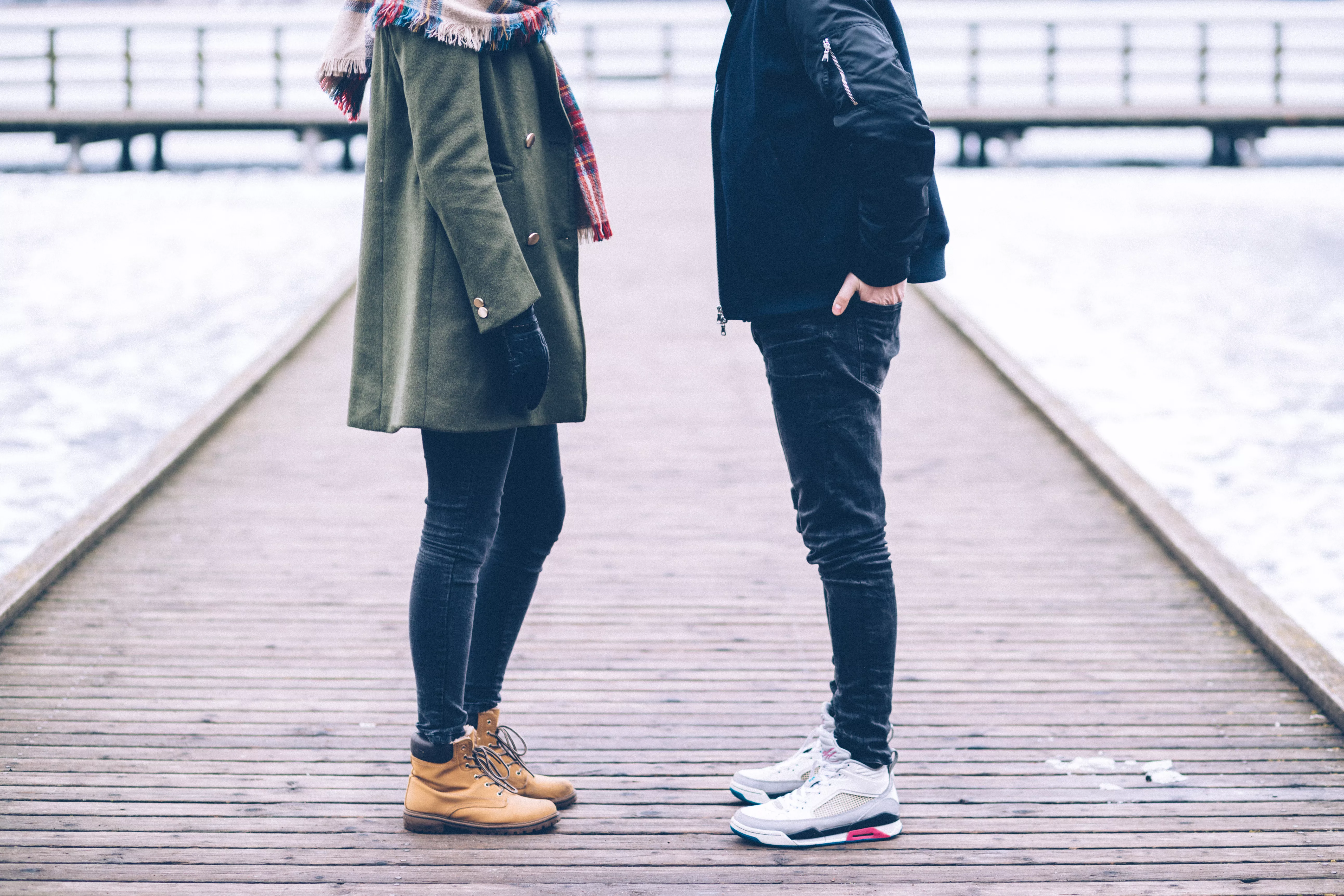 two-people-standing-on-the-pier