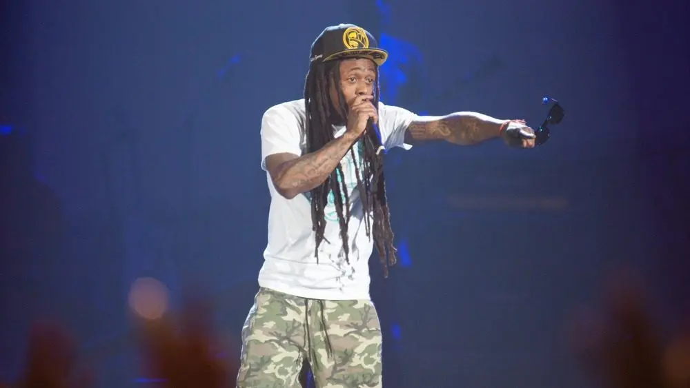 Rapper Dwayne Michael Carter^ Jr. aka Lil Wayne performs in concert as part of America's Most Wanted Tour at Sleep Train Arena on August 28^ 2013 in Sacramento^ California.