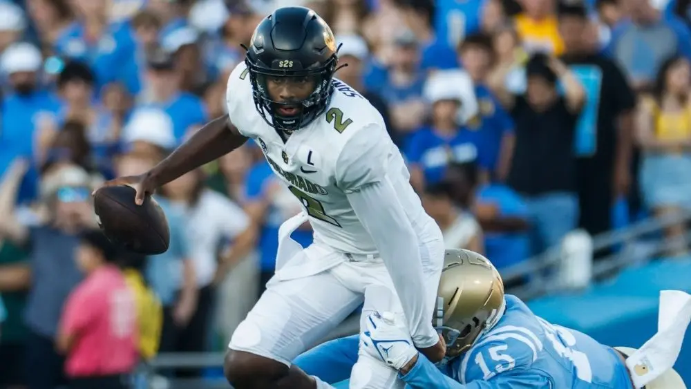Colorado quarterback Shedeur Sanders #2 is tackled by UCLA defensive line Laiatu Latu #15 during an NCAA college football game between the UCLA and the Colorado^ Oct. 28^ 2023^ in Pasadena^ Calif.