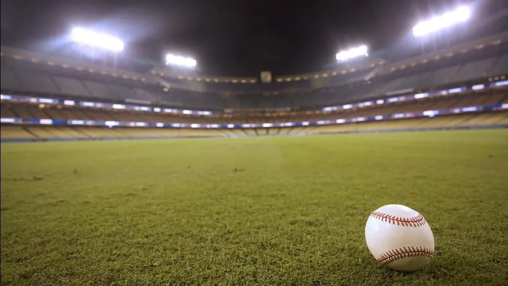 Selective focus of baseball in outfield grass at Dodger Stadium Los Angeles - October 12^ 2022
