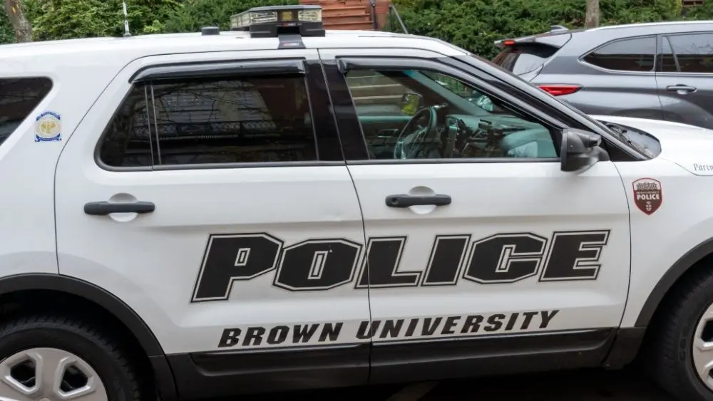 A police car in Brown University campus in Providence^ RI^ USA^ on November 10^ 2023. Brown University is a private Ivy League research university in Providence^ Rhode Island.