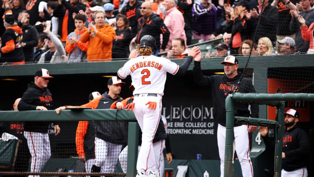 Gunnar Henderson #2 of the Baltimore Orioles is congratulated by manager Brandon Hyde #18 after scoring a run in the second inning during the game between the New York Yankees and the Baltimore Orioles at Oriole Park at Camden Yards on Friday, April 7, 2023 in Baltimore, Maryland. (Photo by Rob Tringali/MLB Photos via Getty Images)