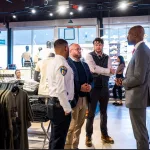 Commissioner Richard Worley and Baltimore Police Department at a shoe store.