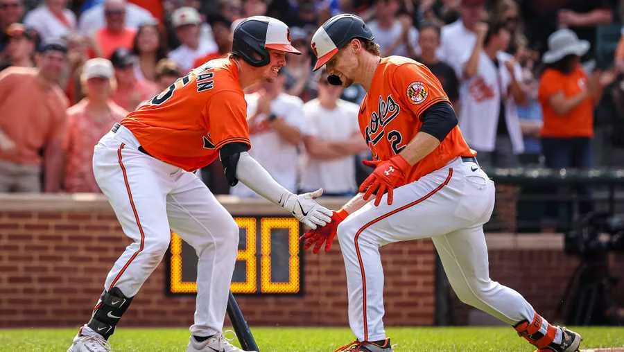 BALTIMORE, MD - JUNE 10: Gunnar Henderson #2 of the Baltimore Orioles celebrates with Adley Rutschman #35 after hitting a home run against the Kansas City Royals during the second inning at Oriole Park at Camden Yards on June 10, 2023 in Baltimore, Maryland. (Photo by Scott Taetsch/Getty Images) SOURCE: Scott Taetsch