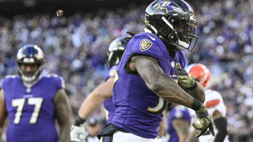 Baltimore Ravens running back Gus Edwards celebrates after scoring against the Cleveland Browns during the second half on an NFL football game Sunday, Nov. 12, 2023, in Baltimore. (AP Photo/Nick Wass)