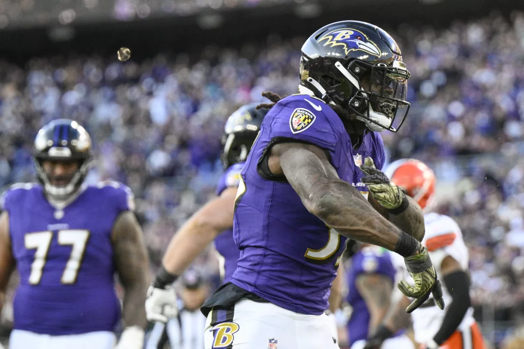 Baltimore Ravens running back Gus Edwards celebrates after scoring against the Cleveland Browns during the second half on an NFL football game Sunday, Nov. 12, 2023, in Baltimore. (AP Photo/Nick Wass)