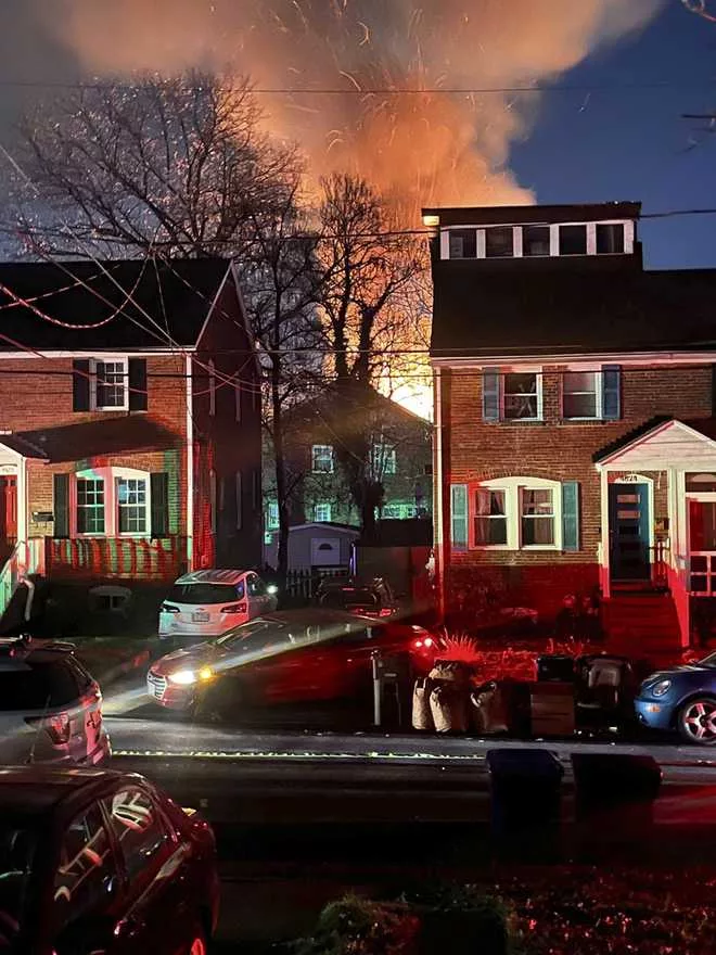 A home is seen exploding from a distance, Monday night, Dec. 4, 2023 in Arlington, Va. (Associated Press)