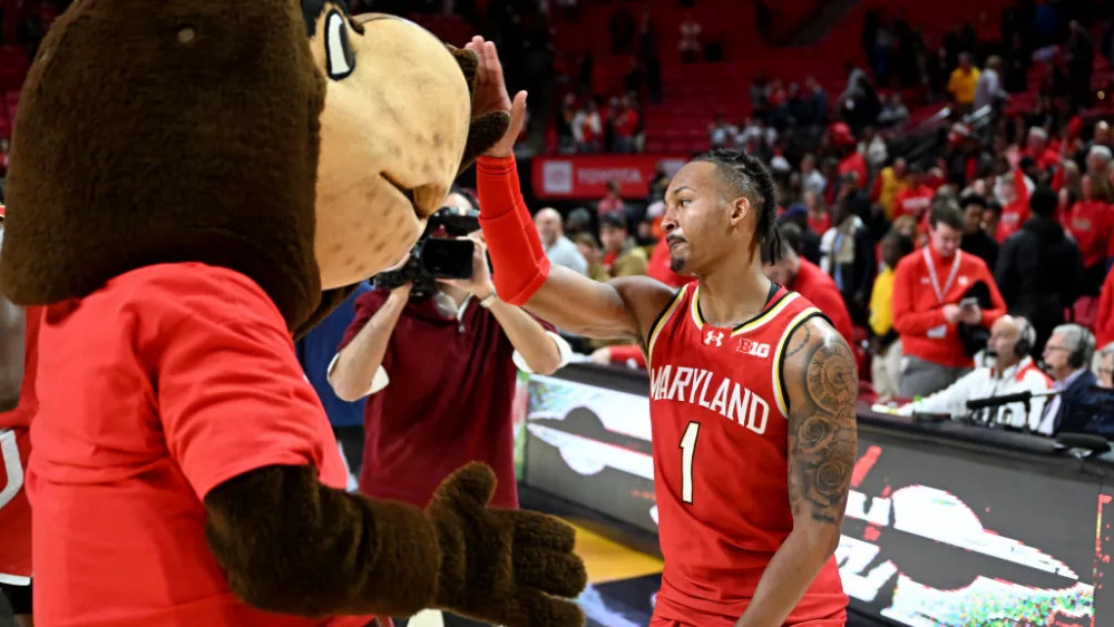 COLLEGE PARK, MARYLAND - DECEMBER 06: Jahmir Young #1 of the Maryland Terrapins celebrates with Testudo after a 81-75 overtime victory against the Penn State Nittany Lions at Xfinity Center on December 06, 2023 in College Park, Maryland. (Photo by Greg Fiume/Getty Images)