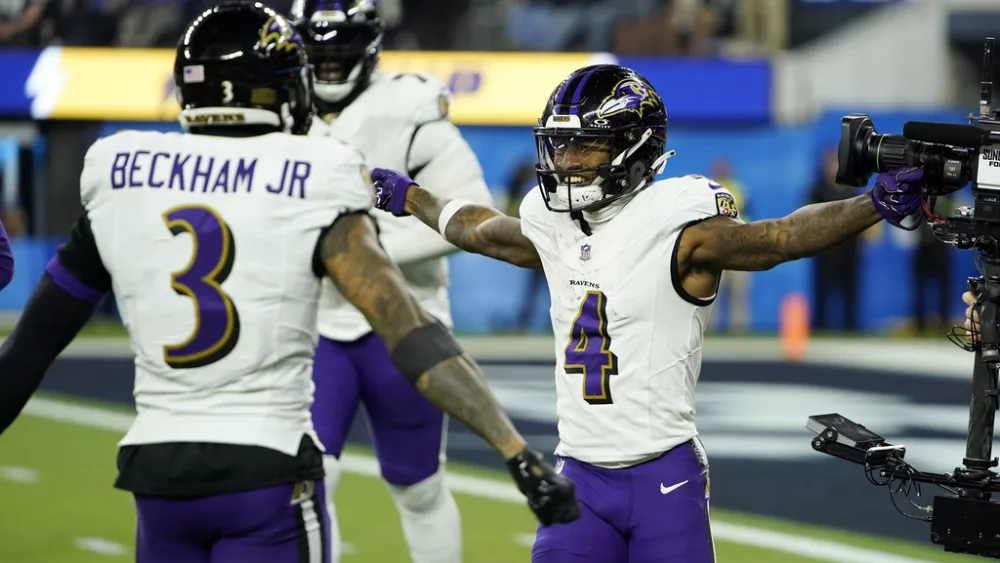 .Baltimore Ravens wide receiver Zay Flowers (4) celebrates his touchdown run with wide receiver Odell Beckham Jr. (3) during the second half of an NFL football game Sunday, Nov. 26, 2023, in Inglewood, Calif. (AP Photo/Ryan Sun)