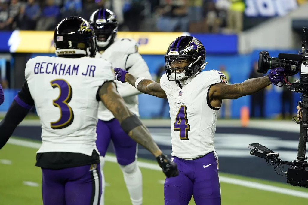 .Baltimore Ravens wide receiver Zay Flowers (4) celebrates his touchdown run with wide receiver Odell Beckham Jr. (3) during the second half of an NFL football game Sunday, Nov. 26, 2023, in Inglewood, Calif. (AP Photo/Ryan Sun)