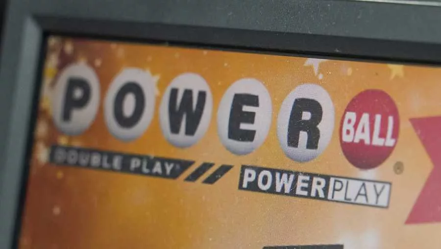 FILE - A display panel advertises tickets for a Powerball drawing at a convenience store, Nov. 7, 2022, in Renfrew, Pa. SOURCE: Keith Srakocic