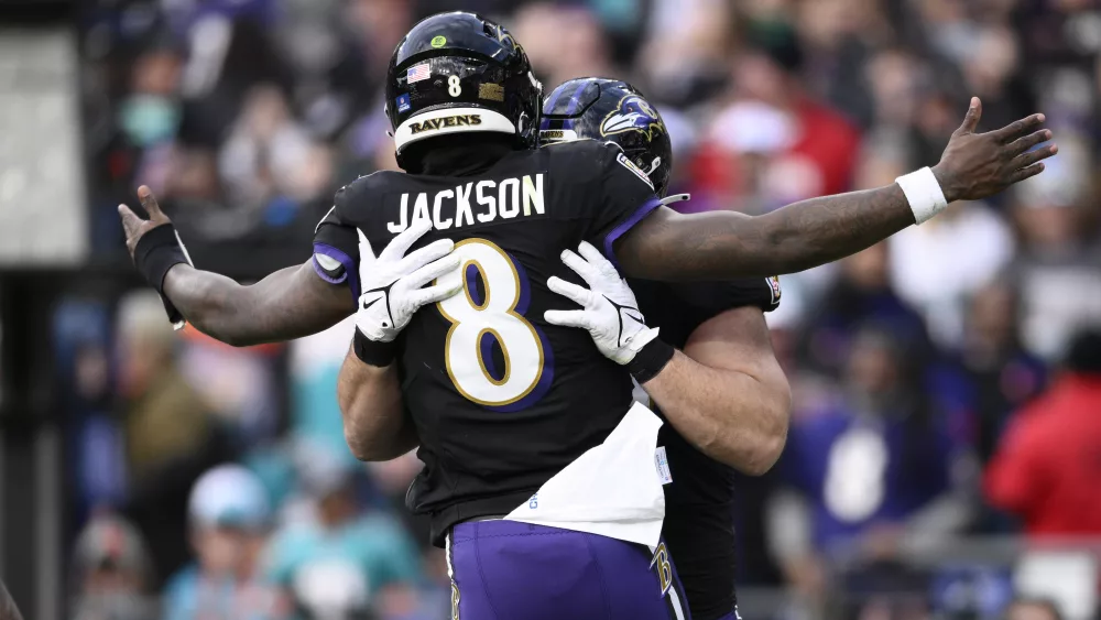 In what may have been his final bid for the MVP award, Lamar Jackson threw for 321 yards and five touchdowns, finishing with a perfect passer rating and helping the Baltimore Ravens clinch the top seed in the AFC with a 56-19 rout of the Miami Dolphins.