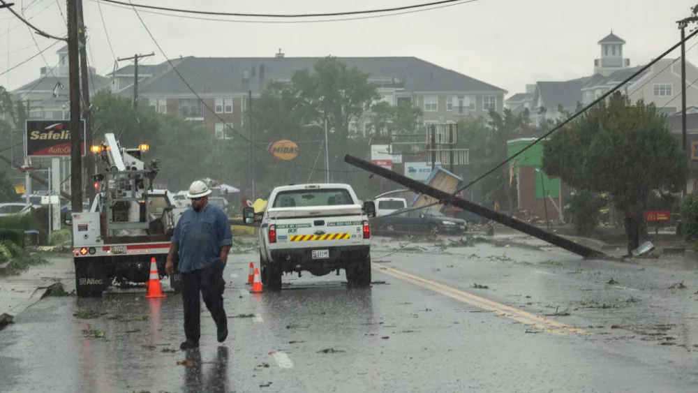 ANNAPOLIS, MD - SEPTEMBER 01: A utility worker from Baltimore Gas and Electric surveys the damage from a tornado on West Street in Annapolis, Maryland on September 1, 2021. The remnants of Hurricane Ida spawned a tornado that touched down in Annapolis, Maryland on Wednesday afternoon. (Photo by Drew Angerer/Getty Images)