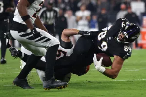 BALTIMORE, MARYLAND - NOVEMBER 16: Mark Andrews #89 of the Baltimore Ravens is tackled by Logan Wilson #55 of the Cincinnati Bengals during the first quarter of the game at M&T Bank Stadium on November 16, 2023 in Baltimore, Maryland. (Photo by Patrick Smith/Getty Images)