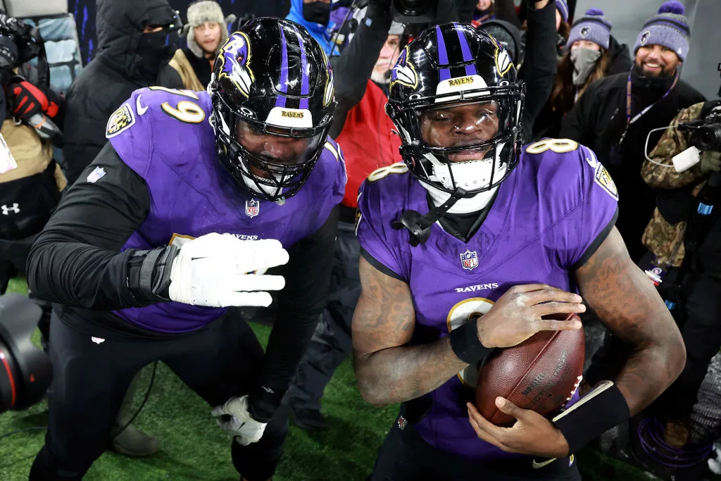 BALTIMORE, MARYLAND - JANUARY 20: Lamar Jackson #8 of the Baltimore Ravens celebrates with Ronnie Stanley #79 after scoring an 8 yard touchdown against the Houston Texans during the fourth quarter in the AFC Divisional Playoff game at M&T Bank Stadium on January 20, 2024 in Baltimore, Maryland. (Photo by Rob Carr/Getty Images)