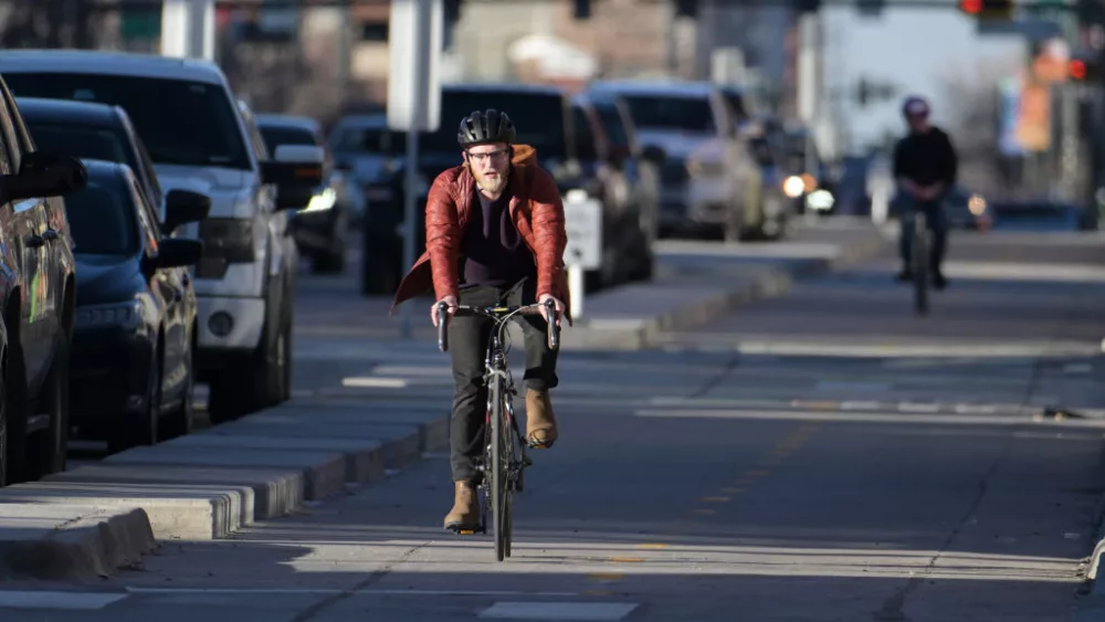 DENVER, CO - FEBRUARY 14 : Cyclists travel on the South Broadway bike lane in Denver, Colorado on Wednesday, February 14, 2024. (Photo by Hyoung Chang/The Denver Post)