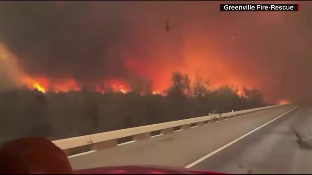 A series of wildfires swept across the Texas Panhandle early Wednesday, prompting evacuations, cutting off power to thousands, and forcing the brief shutdown of a nuclear weapons facility as strong winds, dry grass and unseasonably warm temperatures fed the blazes. Republican Gov. Greg Abbott issued a disaster declaration for 60 counties as the main blaze, the Smokehouse Creek Fire, swelled into the second-largest wildfire in the state's history. The main facility that disassembles America’s nuclear arsenal paused operations Tuesday night but said it was open for normal work on Wednesday.