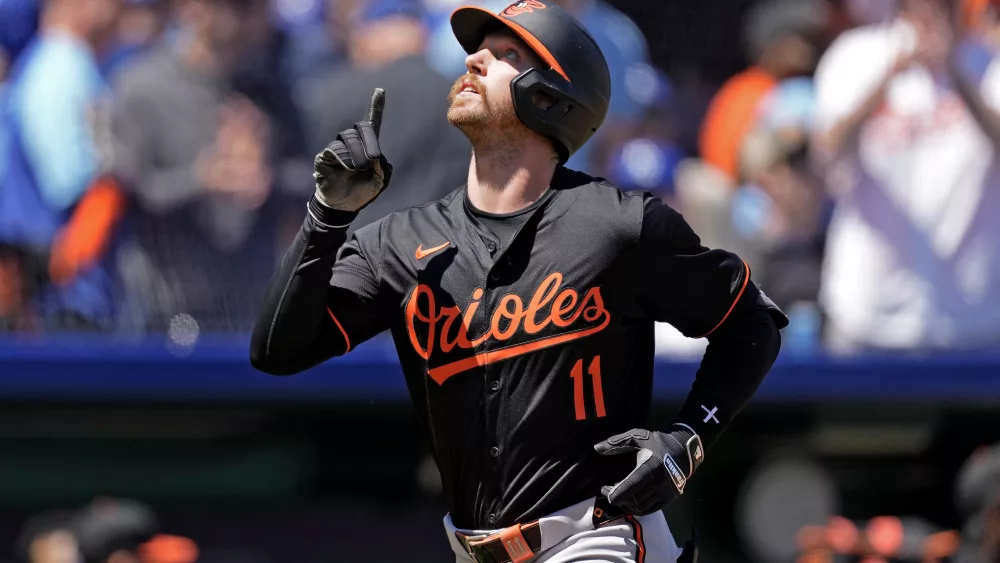 Baltimore Orioles' Jordan Westburg celebrates as he crosses the plate after hitting a solo home run during the third inning of a baseball game against the Kansas City Royals Sunday, April 21, 2024, in Kansas City, Mo. (AP Photo/Charlie Riedel)