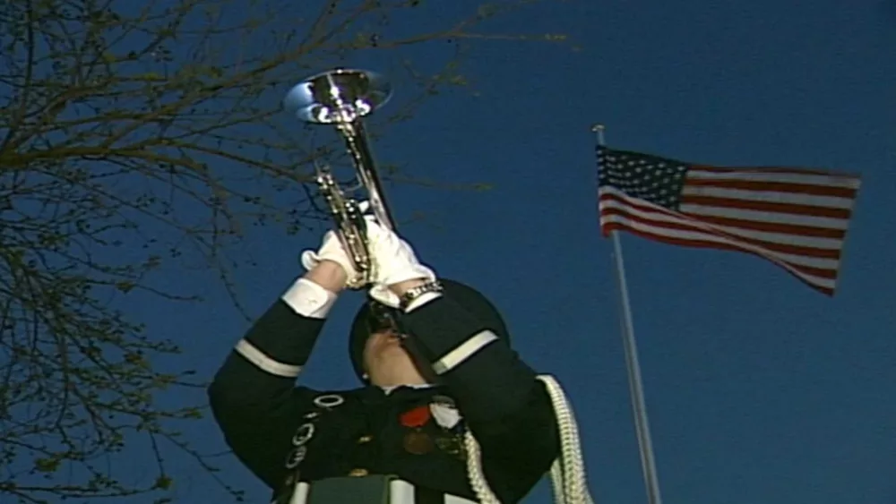 A bugler paid tribute to soldiers in Iraq by playing the bugle call "Taps" every evening in her front yard. She considered this a tribute to those who have lost their lives.