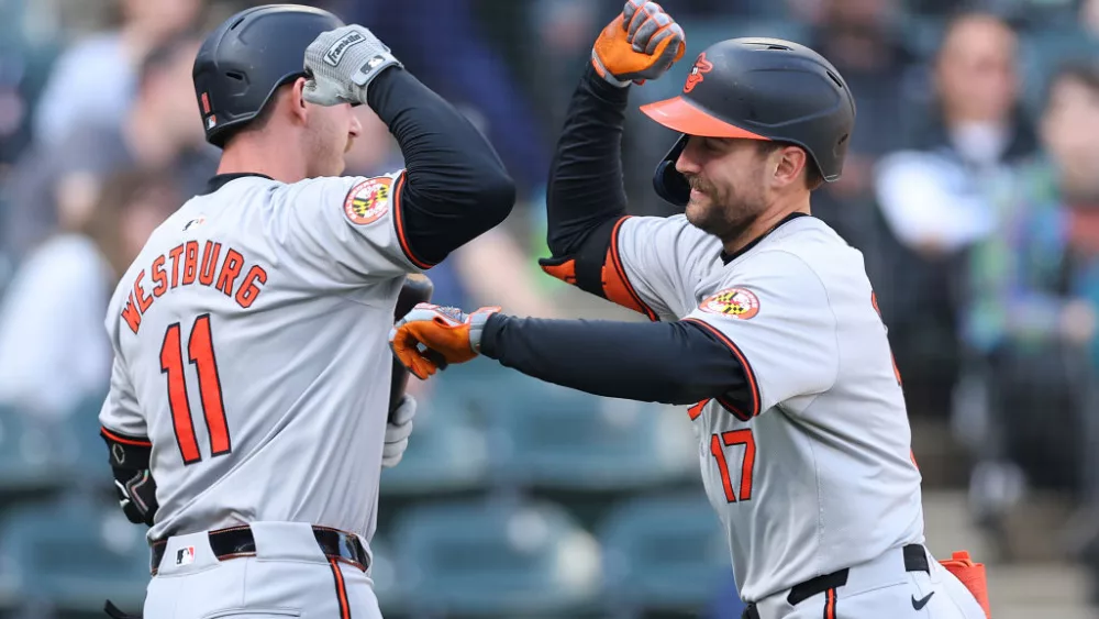 CHICAGO, ILLINOIS - MAY 26: Colton Cowser #17 of the Baltimore Orioles high fives Jordan Westburg #11 after hitting a solo home run off Michael Soroka #40 of the Chicago White Sox (not pictured) during the eighth inning at Guaranteed Rate Field on May 26, 2024 in Chicago, Illinois. (Photo by Michael Reaves/Getty Images) The Baltimore Orioles are set to face the Tampa Bay Rays for the first time this season in a weekend series at Camden Yards. The Orioles, currently trailing the first-place New York Yankees in the division standings, have had a successful road trip, winning six of their last 10 games. The Orioles' winning streak includes a series sweep against the Chicago White Sox. Meanwhile, the Rays, recently swept by the Red Sox, are coming off a six-game losing streak. The Rays offense just has not been producing the way they hoped. Isaac Paredes leads most all of their hitting categories, including batting average, home runs, and RBI. Meanwhile, Gunnar Henderson has not only been crushing the ball for the Orioles but also tops the home run list for the entire league after he blasted his 18th of the year in a grand slam against Boston. These division rivals will begin their series Friday night in Baltimore.