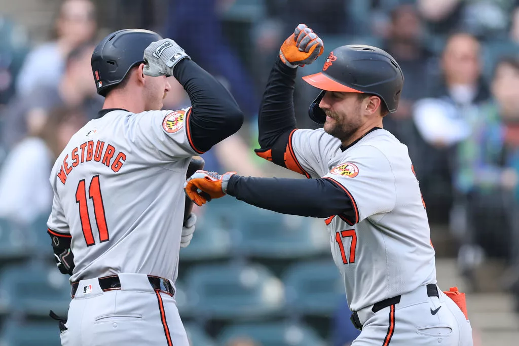 CHICAGO, ILLINOIS - MAY 26: Colton Cowser #17 of the Baltimore Orioles high fives Jordan Westburg #11 after hitting a solo home run off Michael Soroka #40 of the Chicago White Sox (not pictured) during the eighth inning at Guaranteed Rate Field on May 26, 2024 in Chicago, Illinois. (Photo by Michael Reaves/Getty Images) The Baltimore Orioles are set to face the Tampa Bay Rays for the first time this season in a weekend series at Camden Yards. The Orioles, currently trailing the first-place New York Yankees in the division standings, have had a successful road trip, winning six of their last 10 games. The Orioles' winning streak includes a series sweep against the Chicago White Sox. Meanwhile, the Rays, recently swept by the Red Sox, are coming off a six-game losing streak. The Rays offense just has not been producing the way they hoped. Isaac Paredes leads most all of their hitting categories, including batting average, home runs, and RBI. Meanwhile, Gunnar Henderson has not only been crushing the ball for the Orioles but also tops the home run list for the entire league after he blasted his 18th of the year in a grand slam against Boston. These division rivals will begin their series Friday night in Baltimore.