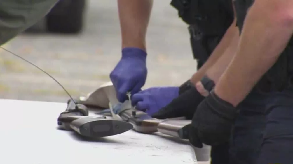 Police handle gun with gloves on. Topic: Organizers of a gun buyback event in Baltimore County hope to prevent criminals from getting their hands on dangerous weapons. The Baltimore County chapter of the National Association for the Advancement of Colored People is partnering with county police to host a gun buyback event this weekend with the goal of getting the weapons off the streets and out of the hands of people who might do harm. Danita Tolson, president of the Baltimore County chapter of the NAACP, told 11 News it's a group effort to get firearms off the street. Last year, a similar event recovered 300 guns and 600 gun-related supplies, and organizers hope to do even better this year.