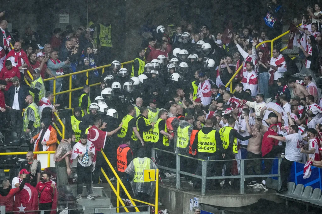 Fighting breaks out between Turkey and Georgia fans inside stadium at ...