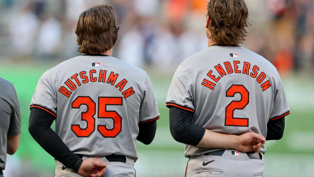 BRONX, NY - JUNE 18: Adley Rutschman #35 of the Baltimore Orioles and Gunnar Henderson #2 during the National Anthem on the field prior to the game against the New York Yankees on June 18, 2024 at Yankee Stadium in Bronx, New York. (Photo by Rich Graessle/Icon Sportswire via Getty Images)